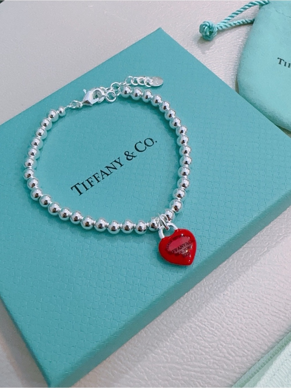 Tiffany & Co. Silver Bead Bracelet with Red Heart Charm